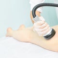 Vacuum massage device. Anti cellulite body correction treatment. Loss weight apparatus. Woman and doctor at medicine salon Royalty Free Stock Photo