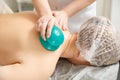Vacuum massage. Vacuum cups of medical cupping therapy on woman back, close up, chinese medicine. Royalty Free Stock Photo