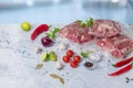 Vacuum packed meat and vegetables on a marble Royalty Free Stock Photo