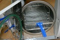 Vacuum steriliser chamber with rack removal tool