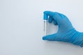 Vacuum tube for collection and blood samples in blue gloves. Royalty Free Stock Photo