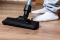 Vacuuming laminate floor.