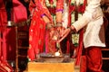 Vadodara, India - 20 july 2018: moment during celebration of traditional lush indian wedding with hindu priest and groom