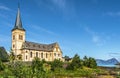 Vagan Church, called Lofoten Cathedral, situated in Kabelvag village in Austvagoya island. Waters of Vestfjord are at right Royalty Free Stock Photo