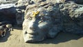 Shiva face carved out of stone in Vagator beach, North Goa, India Royalty Free Stock Photo