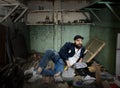 Vagrant in a dirty room Royalty Free Stock Photo