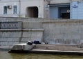 Vagrants sleeping on the embankment of the Vodootvodny canal in Moscow. Royalty Free Stock Photo