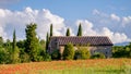 Poppy field and old farmhouse in Tuscany on May 19, 2013