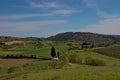 Val D'Orcia, landscape on the infinite valley with lake at the base.