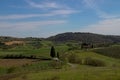 Val D'Orcia, landscape on the infinite valley with lake at the base.