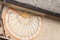 VAL DI FUNES, ITALY - OCTOBER 01, 2016: A detail of the old sundial painted on 1465 over the external wall of the little chapel