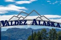 Sign welcoming visitors to Valdez, Alaska. Sign is an arch with