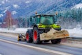 Valdres, Norway - March 26, 2018: Snow-removing machine cleans the street of the road from the snow in the morning snow