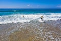 Aerial from surfers getting surfing lessons at Praia Vale Figueiras in Portugal