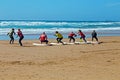 Surfers getting surfing lessons at Praia Vale Figueiras in Portugal