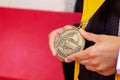 Valedictorian Shows off Medal with Graduation Gown Royalty Free Stock Photo