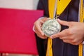 Valedictorian Shows off Medal with Graduation Gown Royalty Free Stock Photo