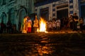 Catholic priest is celebrating night mass around the holy bonfire on hallelujah saturday night. Holy week in Valenca, Bahia Royalty Free Stock Photo