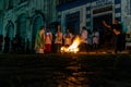 Catholic priest is celebrating night mass around the holy bonfire on hallelujah saturday night. Holy week in Valenca, Bahia Royalty Free Stock Photo