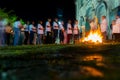 Catholics are around the holy bonfire, on the hallelujah Saturday night, to light their candles. Holy week in Valenca, Bahia