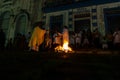 A priest is seen celebrating night mass around the Santa bonfire on Saturday night of Hallelujah. Holy week in Valenca, Bahia Royalty Free Stock Photo