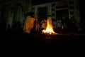 A priest is seen celebrating night mass around the Santa bonfire on Saturday night of Hallelujah. Holy week in Valenca, Bahia Royalty Free Stock Photo