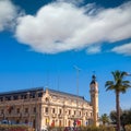 Valencia Port building with tower and palm tree Royalty Free Stock Photo