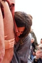 Valencia, Spain - April 9, 2009: Actress playing the role of Virgin Mary prostrate under the cross during the crucifixion of her