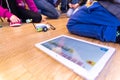 Valencia, Spain - April 13, 2019: Children using a robot motorized, reconfigurable education toy, created with Lego WeDo blocks