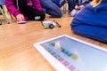 Valencia, Spain - April 13, 2019: Children using a robot motorized, reconfigurable education toy, created with Lego WeDo blocks