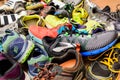 Valencia, Spain - April 7, 2020: Pile of used running sports shoes from various brands