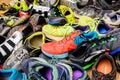 Valencia, Spain - April 7, 2020: Pile of used running sports shoes from various brands