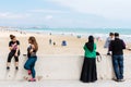 Valencia, Spain - April 29, 2019: Young black women together with Muslim couple with woman with veil enjoying the holidays near