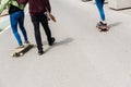 Valencia, Spain - April 29, 2019: Young boys on longboard on a Sunday morning