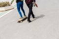 Valencia, Spain - April 29, 2019: Young boys on longboard on a Sunday morning