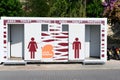 Valencia, Spain, August 19, 2022: Male and female public toilets booths, portable in the street