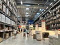 People through the aisles of the Ikea warehouse, a Swedish furniture store, looking for
