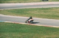 VALENCIA, SPAIN - Dec 08, 2020: Black Motorcycle Pilot Biker Turning a Curve Too Fast during Race Royalty Free Stock Photo