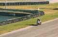 VALENCIA, SPAIN - Dec 06, 2020: White Biker Drives Motorcycle on the Circuit at High Speed