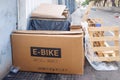 Valencia, Spain - December 28, 2021: After Christmas gifts, empty boxes accumulate as waste in the streets, box of an e-bike