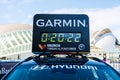 Valencia, Spain - December 3, 2022: Garmin sponsors the timing of the Valencia marathon, with digital clock on a car