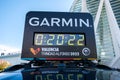 Valencia, Spain - December 3, 2022: Garmin sponsors the timing of the Valencia marathon, with digital clock on a car