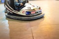 Valencia, Spain - December 14, 2018: Two children`s bumper cars competing among them at an amusement park Royalty Free Stock Photo