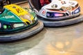 Valencia, Spain - December 14, 2018: Two children`s bumper cars competing among them at an amusement park Royalty Free Stock Photo