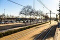 Valencia, Spain - February 28, 2019: Road congested by traffic jam next to empty bike lane and free tram lines, sustainable urban