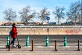 Valencia, Spain - February 28, 2019: Woman moving on her electric scooter transiting a bicycle lane isolated from other vehicles