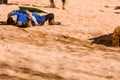 Valencia, Spain - January 27, 2019: An actor disguised as a Medievale knight lying on the ground defeated after a sword battle in