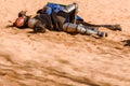 Valencia, Spain - January 27, 2019: Two actors disguised as medieval knights lying on the ground defeated after a sword battle in Royalty Free Stock Photo