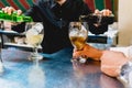 Valencia, Spain - July 05, 2018: Barman preparing glasses of alcohol