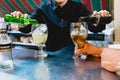 Valencia, Spain - July 05, 2018: Barman preparing glasses of alcohol